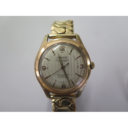 22 - An Onsa gold plated manual wind/super automatic wristwatch - 33mmm case - on a sprung plated strap -... 