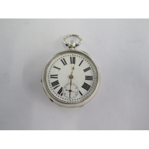 29 - A silver top wind pocket watch - 53mm case - generally good, running order