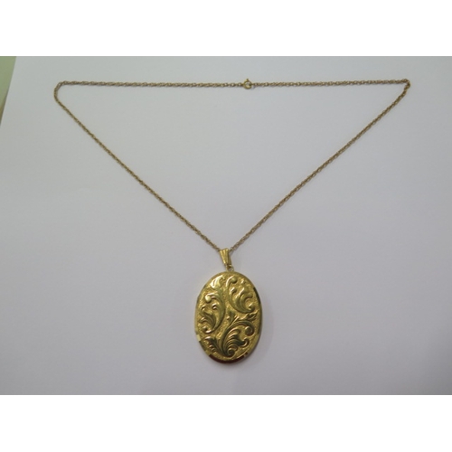 64 - A 9ct yellow gold locket on a 9ct 50cm chain - locket approx 42mm x 32mm - total weight approx 17 gr... 