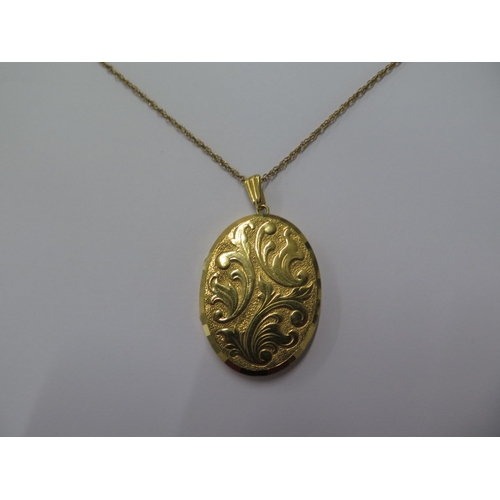 64 - A 9ct yellow gold locket on a 9ct 50cm chain - locket approx 42mm x 32mm - total weight approx 17 gr... 