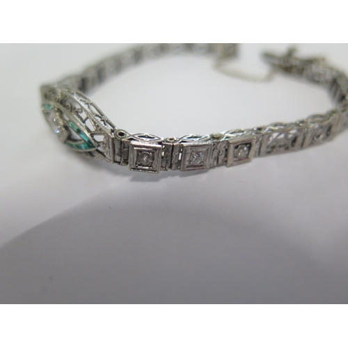 72 - A white metal Art Deco diamond and emerald bracelet - head size 24mm x 10mm - approx weight 9.4 gram... 