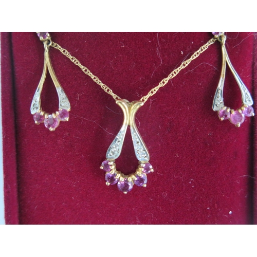 75 - A 9ct yellow gold pendant on chain and matching earring set - approx weight 3.8 grams