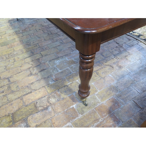 560 - A mahogany pull out dining table with two leaves on turned legs - extends from 120cm to 230cm x 74cm... 