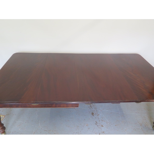 560 - A mahogany pull out dining table with two leaves on turned legs - extends from 120cm to 230cm x 74cm... 