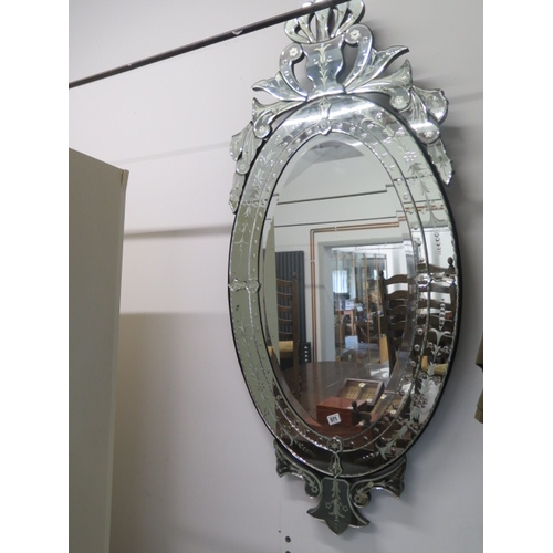 566 - A Venetian style ornate mirror - 144cm x 64cm