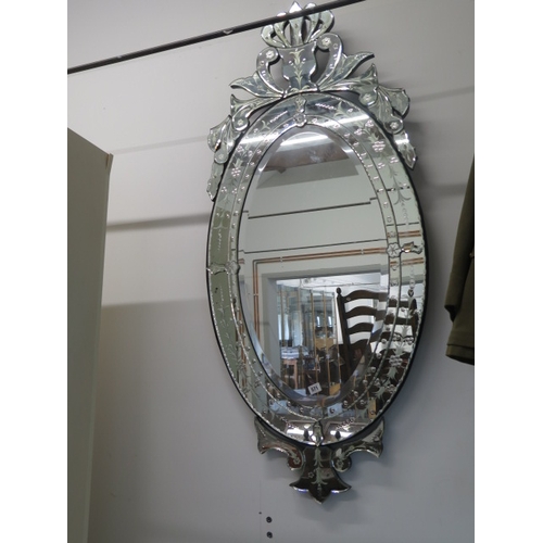 566 - A Venetian style ornate mirror - 144cm x 64cm