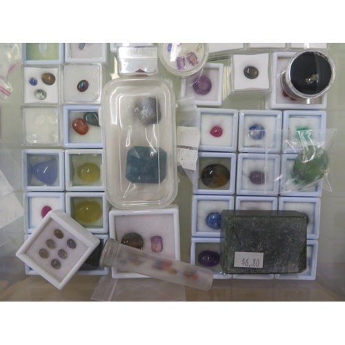 104 - A large collection of loose gem stones including opals, quartz, citrine, tourmaline - with painted i... 