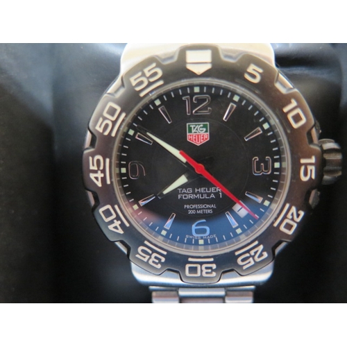 11 - A Tag Heuer Formula 1 quartz gents bracelet wristwatch with black dial - model WAC 1110 serial BT070... 