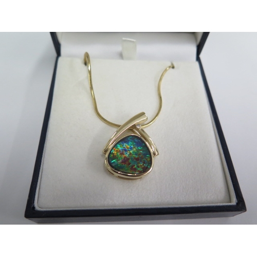 117 - A 14ct Ammolite pendant on 14ct 44cm chain - total weight approx 16.9 grams - in good condition