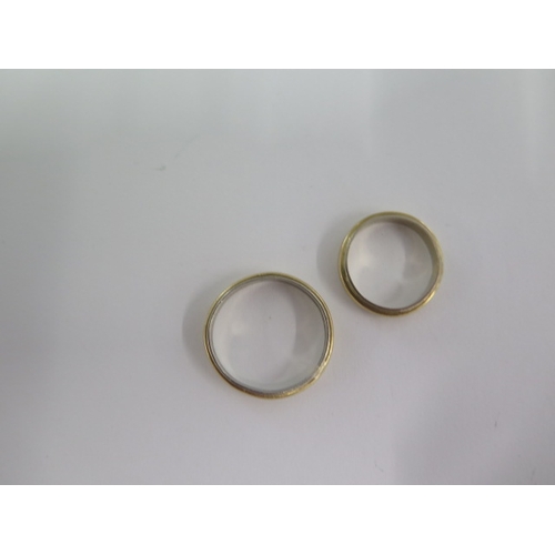 125 - Two yellow and white metal band rings sizes P and H - approx weight 5.7 grams