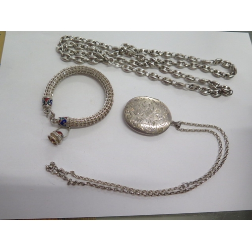 139 - A silver locket on chain, a silver 90cm necklace and a white metal and enamel bracelet - total weigh... 