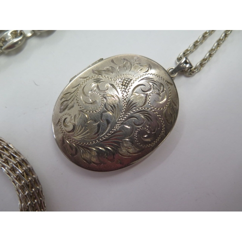 139 - A silver locket on chain, a silver 90cm necklace and a white metal and enamel bracelet - total weigh... 