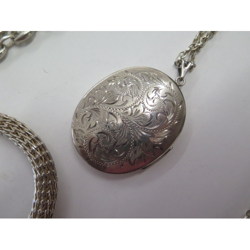 139 - A silver locket on chain, a silver 90cm necklace and a white metal and enamel bracelet - total weigh... 