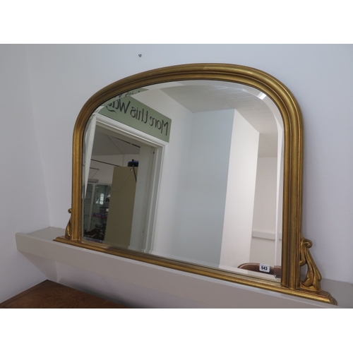 543 - A modern gold coloured over mantle mirror - Width 122cm x Height 76cm