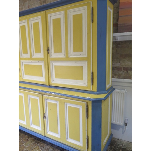 547 - A 19th century continental painted pine two part cupboard on cupboard with panelled doors ad sides -... 