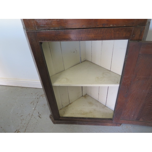 548 - A Georgian oak two part corner cupboard with a base door and painted interior - Height 184cm x Width... 