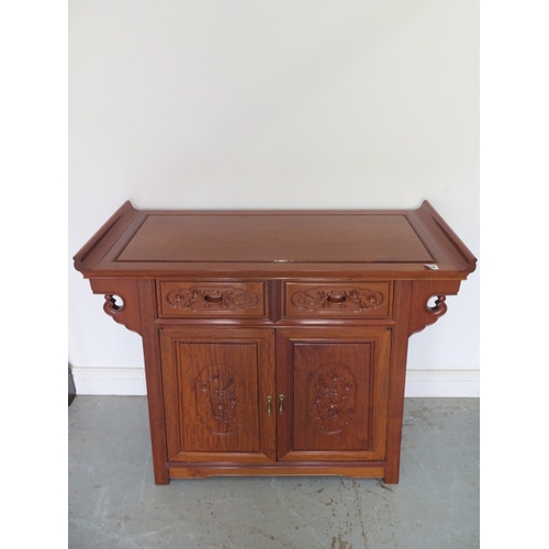 554 - A 20th century Chinese carved alter type cabinet - Height 80cm x Width 93cm x Depth 40cm