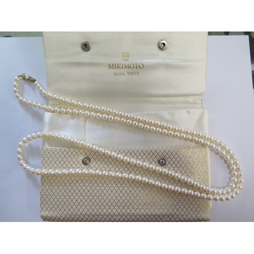 83 - A string of Mikimoto pearls with a 14ct gold clasp - Length 109cm - pearls approx 6mm diameter - goo... 