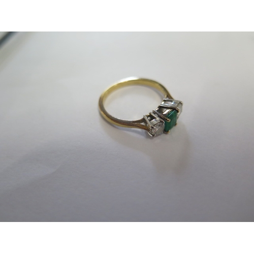 91 - A hallmarked 18ct yellow gold diamond and emerald three stone ring size M/N - approx weight 2.8 gram... 