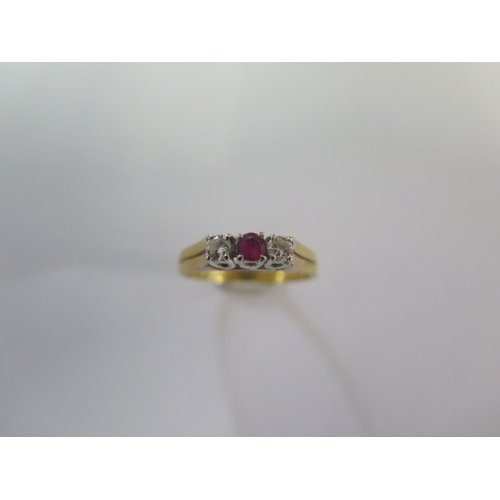 92 - A hallmarked 18ct yellow gold diamond and ruby three stone ring size N - approx weight 3.4 grams - i... 