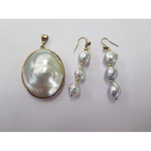 96 - A pearl gilt mounted pendant - 34mm x 24mm and a pair of pearl drop earrings