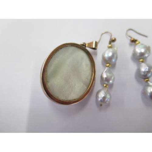 96 - A pearl gilt mounted pendant - 34mm x 24mm and a pair of pearl drop earrings