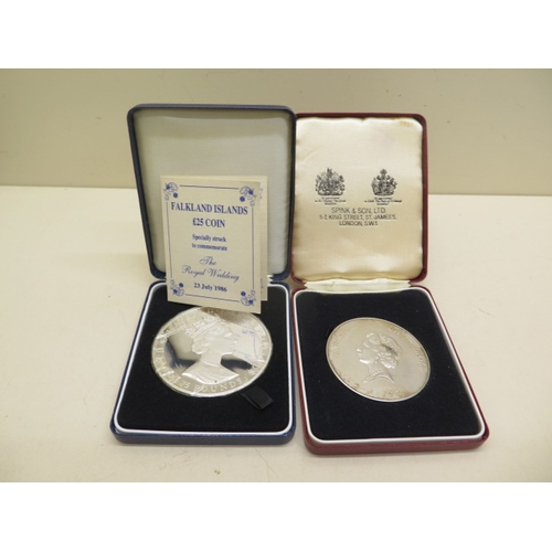 332 - A Spink and Son Silver Jubilee coin, 76 grams and a Faulkland Islands £25 silver coin, 150 grams