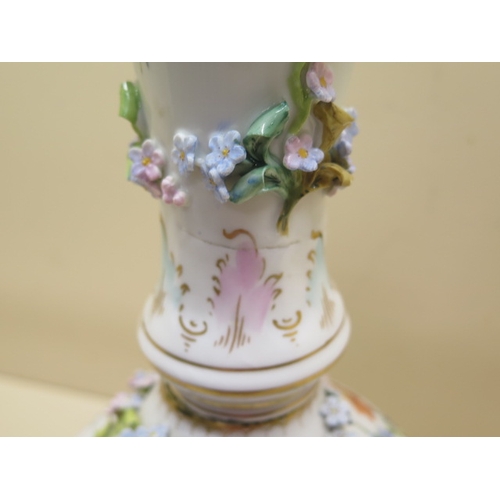 413 - A Continental floral encrusted porcelain oil lamp stand - Height 61cm - some foliate losses and firi... 