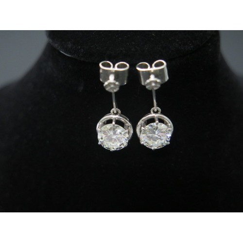 101 - A superb pair of single stone diamond drop earrings - The round brilliant cut stones each measuring ... 