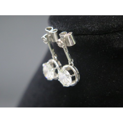 101 - A superb pair of single stone diamond drop earrings - The round brilliant cut stones each measuring ... 