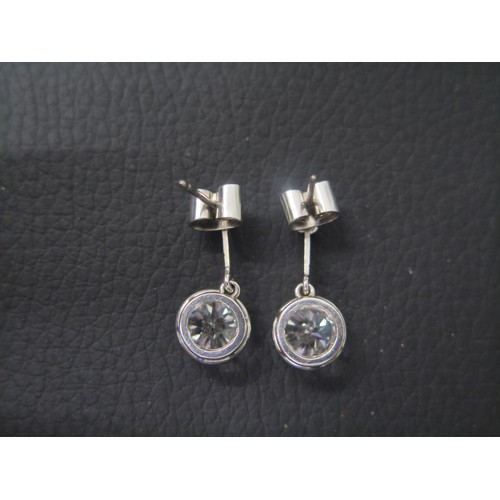 101 - A superb pair of single stone diamond drop earrings - The round brilliant cut stones each measuring ... 