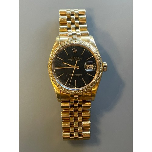 276 - A gents Rolex Datejust in 18ct yellow gold, black dial with diamond bezel, with Rolex 18ct yellow go... 