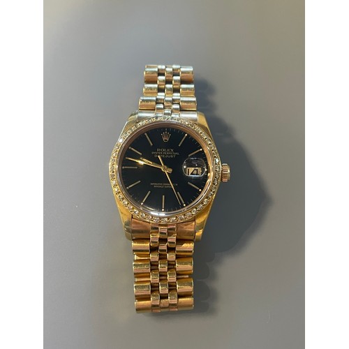 276 - A gents Rolex Datejust in 18ct yellow gold, black dial with diamond bezel, with Rolex 18ct yellow go... 