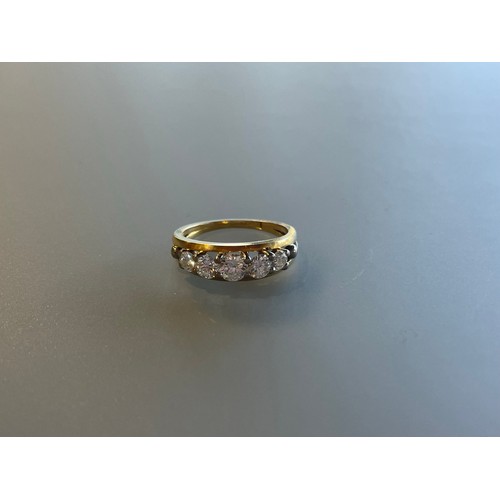 100 - A five stone diamond bridge ring set in 18ct yellow gold - approx total diamond weight 1.1ct - ring ... 