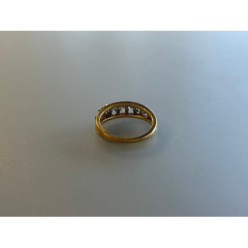 100 - A five stone diamond bridge ring set in 18ct yellow gold - approx total diamond weight 1.1ct - ring ... 