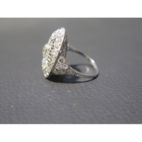 103 - A large 18ct white gold (tested) Art Deco style diamond ring, approx 2.5ct of diamonds - head size a... 