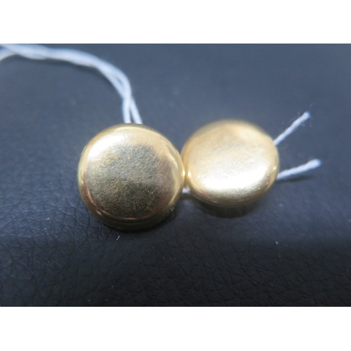 104 - A pair of 18ct yellow gold round clip earrings - approx 1.7cm diameter - weight approx 9 grams