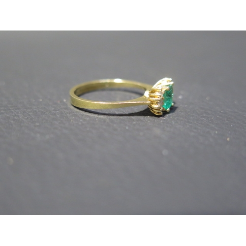 109 - An 18ct yellow gold (tested) emerald and diamond ring, emerald has natural inclusions, diamonds brig... 