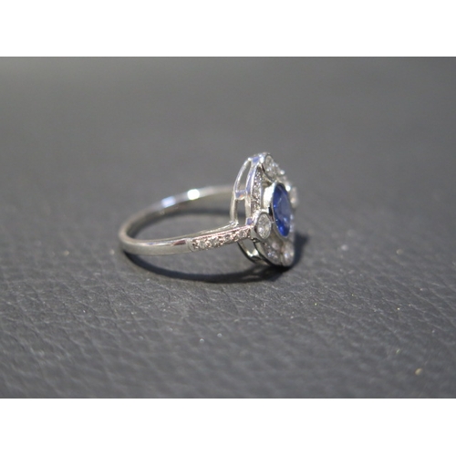 116 - A platinum Art Deco style sapphire and diamond ring - head size approx 14mm x 13mm with diamond shou... 