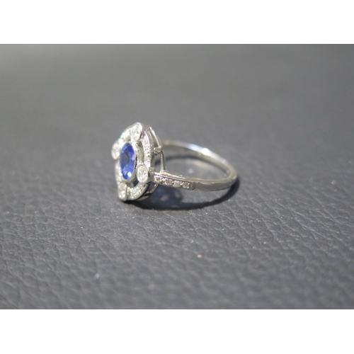 116 - A platinum Art Deco style sapphire and diamond ring - head size approx 14mm x 13mm with diamond shou... 