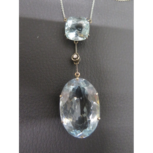 130 - A good Art Deco aquamarine pendant on chain - The cushion shaped aquamarine approx 1.5cm x 1.5cm wit... 