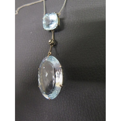 130 - A good Art Deco aquamarine pendant on chain - The cushion shaped aquamarine approx 1.5cm x 1.5cm wit... 