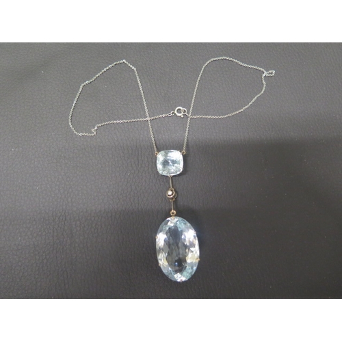 130 - A good Art Deco aquamarine pendant on chain - The cushion shaped aquamarine approx 1.5cm x 1.5cm wit... 