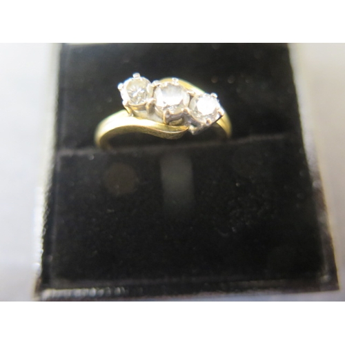 136 - An 18ct yellow gold three stone diamond ring - approx weight 0.6ct in total - ring size P - weight a... 