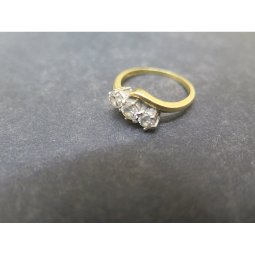 136 - An 18ct yellow gold three stone diamond ring - approx weight 0.6ct in total - ring size P - weight a... 