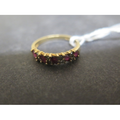 140 - A 9ct yellow gold ruby and diamond bridge ring size N/O - weight approx 2.2 grams