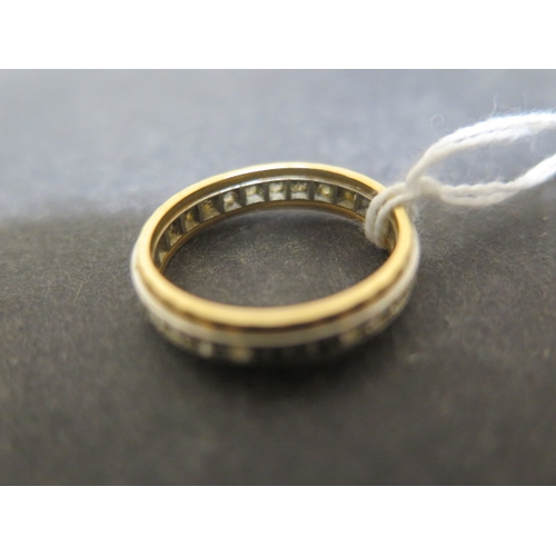 144 - An 18ct bi colour gold and CZ eternity ring size O - weight approx 4.4 grams