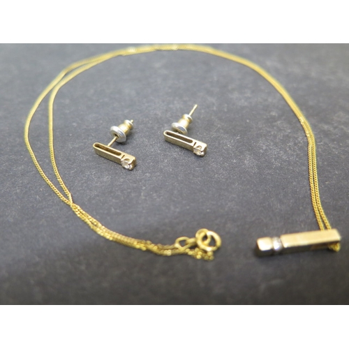 146 - A 9ct yellow gold pendant and chain with diamond and matching earrings - pendant approx 1.5cm - tota... 