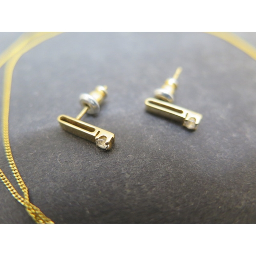 146 - A 9ct yellow gold pendant and chain with diamond and matching earrings - pendant approx 1.5cm - tota... 