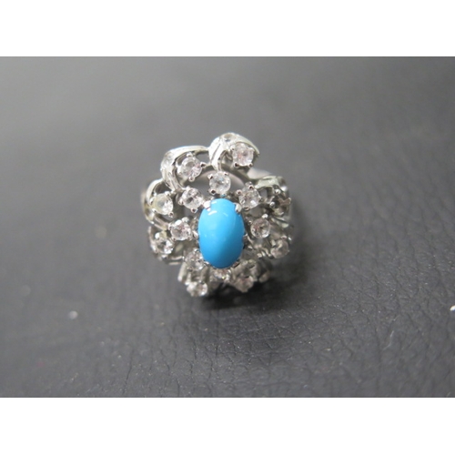 150 - A 14ct white gold (unmarked but tested) ring with turquoise white sapphire - ring size R - weight ap... 